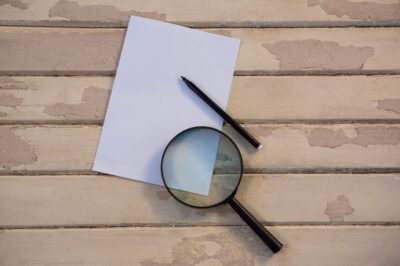 blank paper with magnifying glass pencil 1252 282