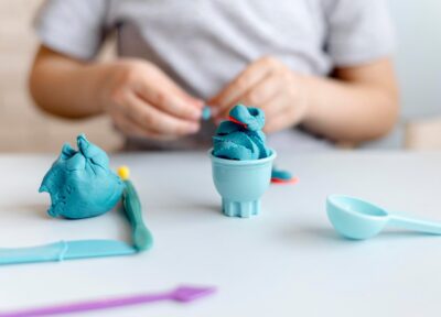 close up kid with blue toys 23 2148551420